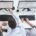 People working on workstations pointing at the screen